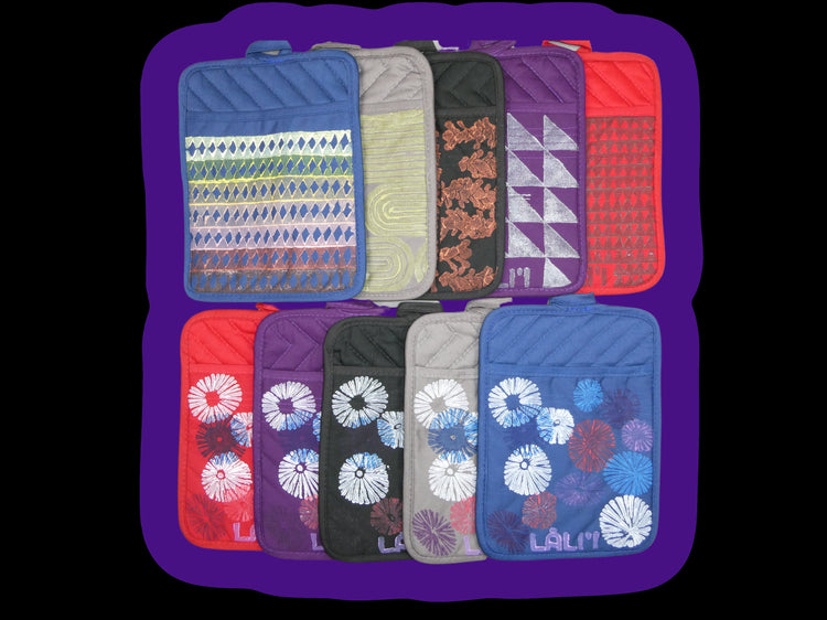 Versitile Pot Holder / Oven Mit. Available in assortment of colors and designs. Features material hook for optional hanging, and front pocket for use as an oven mit.